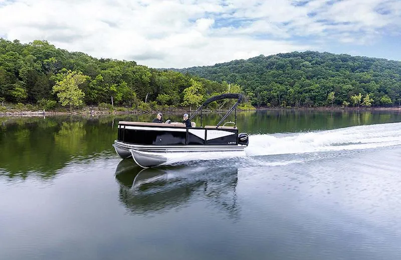 Slide: The Image of 2025 Lowe LS170 pontoon boat cruising on a scenic lake. - 3