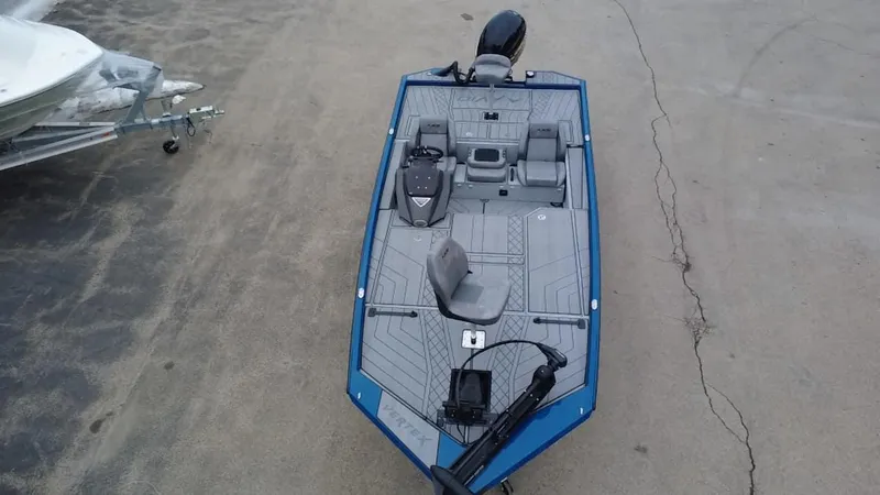 Slide: The Image of 2025 Avid 20 Vertex boat, top view, parked on concrete surface. - 10