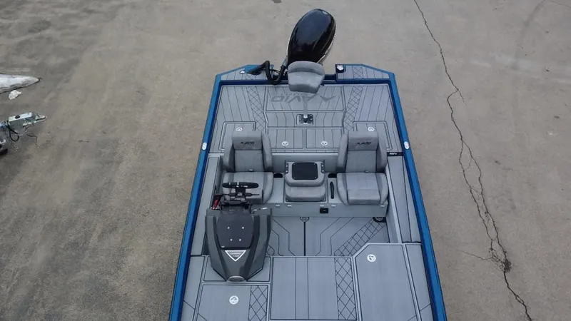 Slide: The Image of Avid 20 Vertex 2025 boat interior with seating and motor, viewed from above. - 11