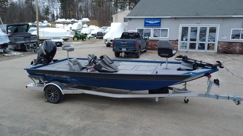 Slide: The Image of 2025 Avid 20 Vertex boat on trailer, parked outside a dealership. - 4