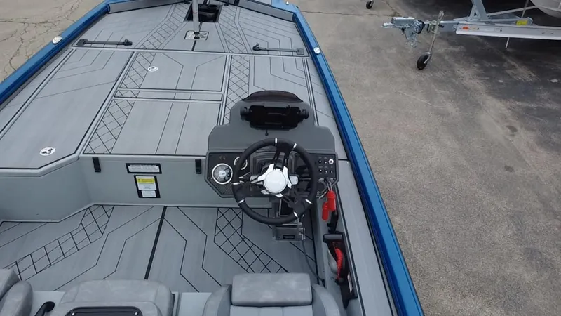 Slide: The Image of 2025 Avid 20 Vertex boat interior with steering wheel and modern design. - 9