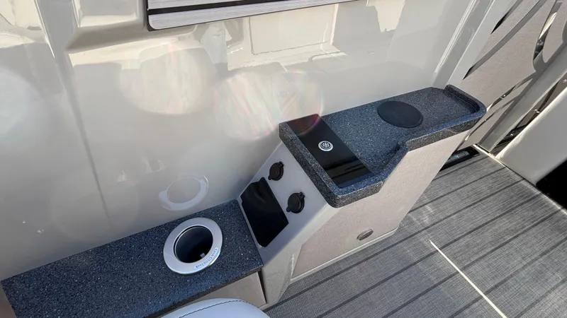 Slide: The Image of Interior of 2025 Balise HORIZON 24C boat with seating and pet bowls. - 22