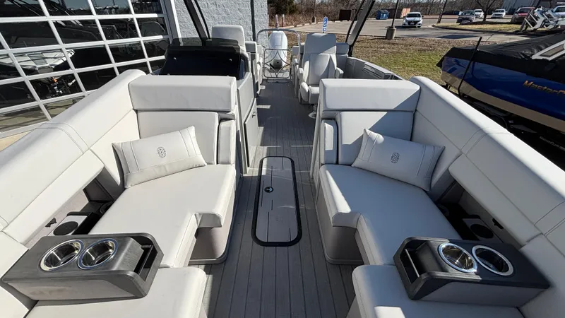 Slide: The Image of Luxurious 2025 Balise HORIZON 24C boat interior with plush seating and cup holders. - 28