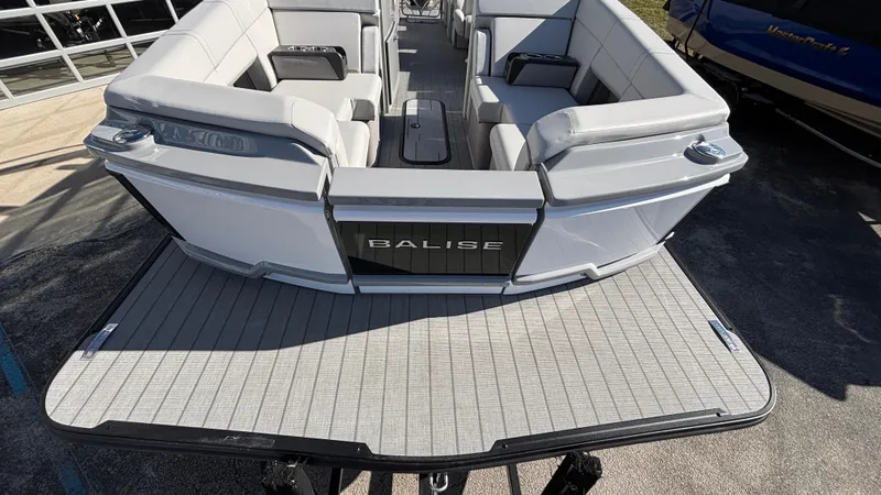 Slide: The Image of 2025 Balise HORIZON 24C boat with spacious seating, docked outdoors. - 3