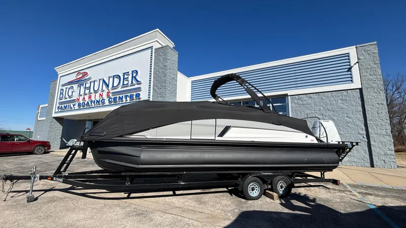 Slide: The Image of 2025 Balise HORIZON 24C boat on trailer outside dealership, sunny day. - 35