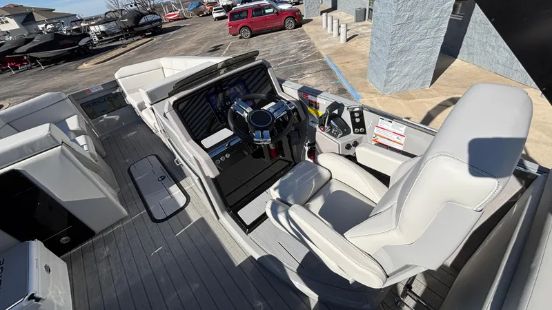 Slide: The Image of 2025 Balise HORIZON 24C boat interior with white seating and storage compartments. - 9