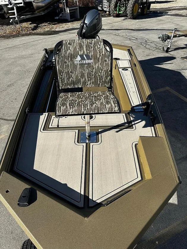 Slide: The Image of 2025 Avid 16 Commander boat with camouflage seating and sleek deck design. - 5