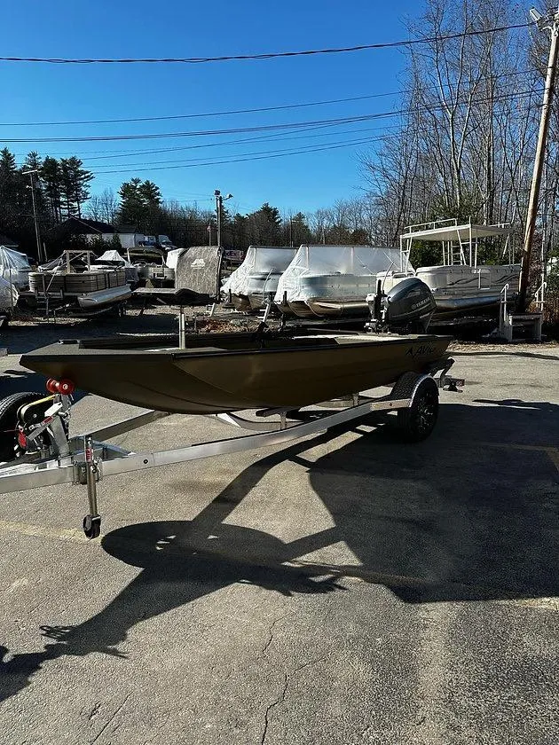 Slide: The Image of 2025 Avid 16 Commander boat on trailer in outdoor storage area. - 7