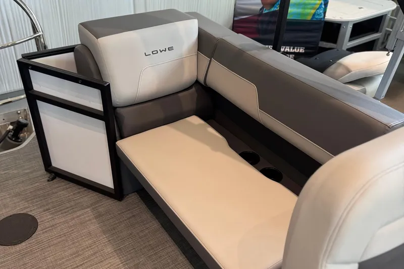 Slide: The Image of Lowe LS 210 WT 2025 boat seating with cup holders, featuring modern design and comfort. - 2