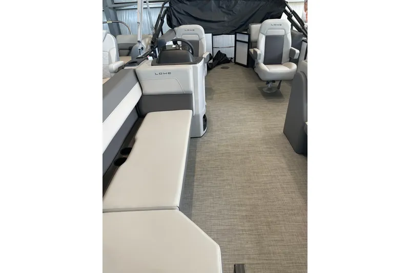 Slide: The Image of Interior of 2025 Lowe LS 210 WT boat with gray seating and modern design. - 7