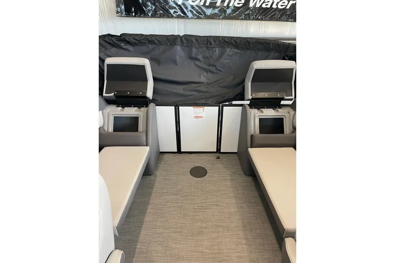 Slide: The Image of Interior of 2025 Lowe LS 210 WT boat with seating and storage compartments. - 8