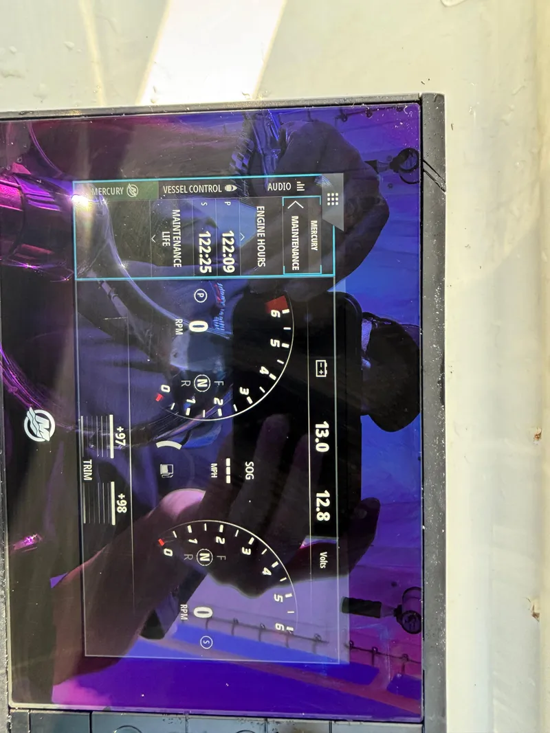 Slide: The Image of Dashboard display of a 2012 Yellowfin 29 boat with digital gauges and controls. - 21