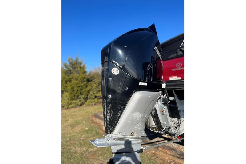 Slide: The Image of 2023 Regency 250DL3 boat with Mercury Verado outboard motor, outdoors on a sunny day. - 9