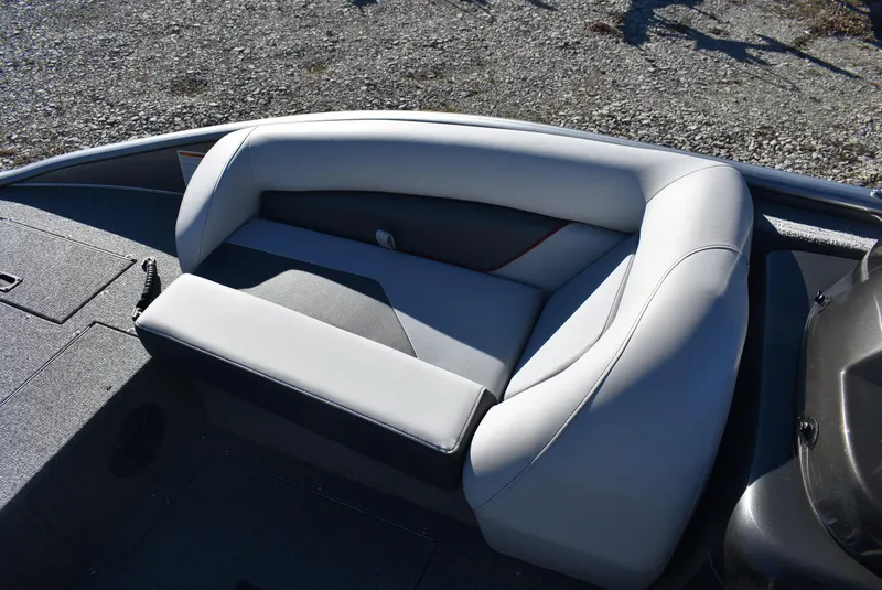 Slide: The Image of 2025 Lowe SD224 Sport Deck boat with sleek seating design on gravel background. - 12