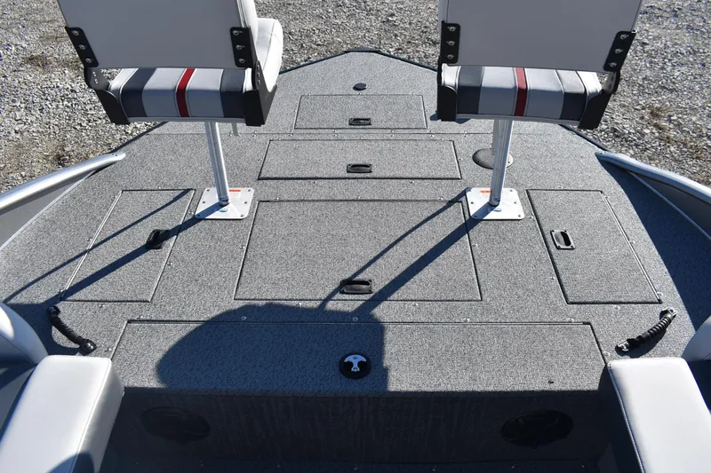 Slide: The Image of 2025 Lowe SD224 Sport Deck boat interior with seating and storage compartments. - 14