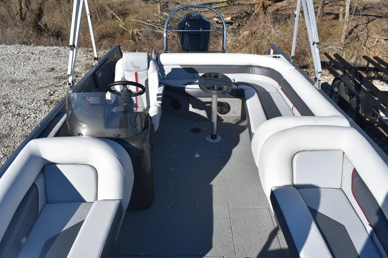 Slide: The Image of 2025 Lowe SD224 Sport Deck boat interior with spacious seating and steering console. - 15