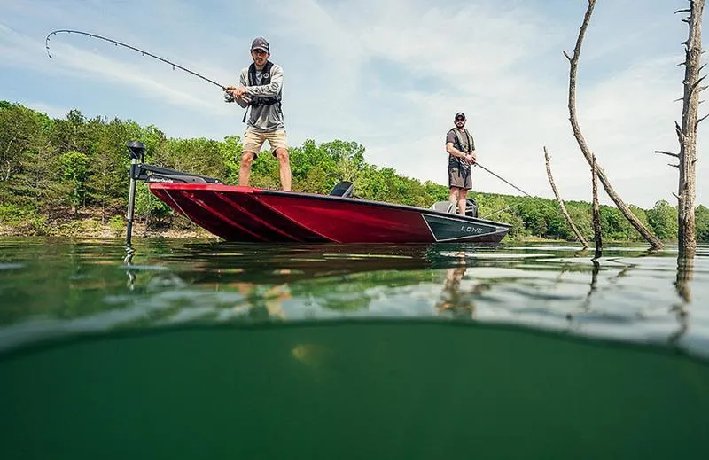 Slide: The Image of Two people fishing on a 2025 Stinger 175C boat in a scenic lake. - 6