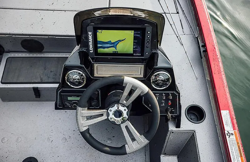 Slide: The Image of 2025 Stinger 175C boat dashboard with steering wheel and navigation display. - 7