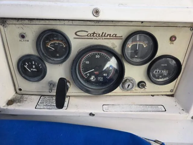 Slide: The Image of Instrument panel of a 1983 Catalina 30 yacht with gauges and controls. - 14