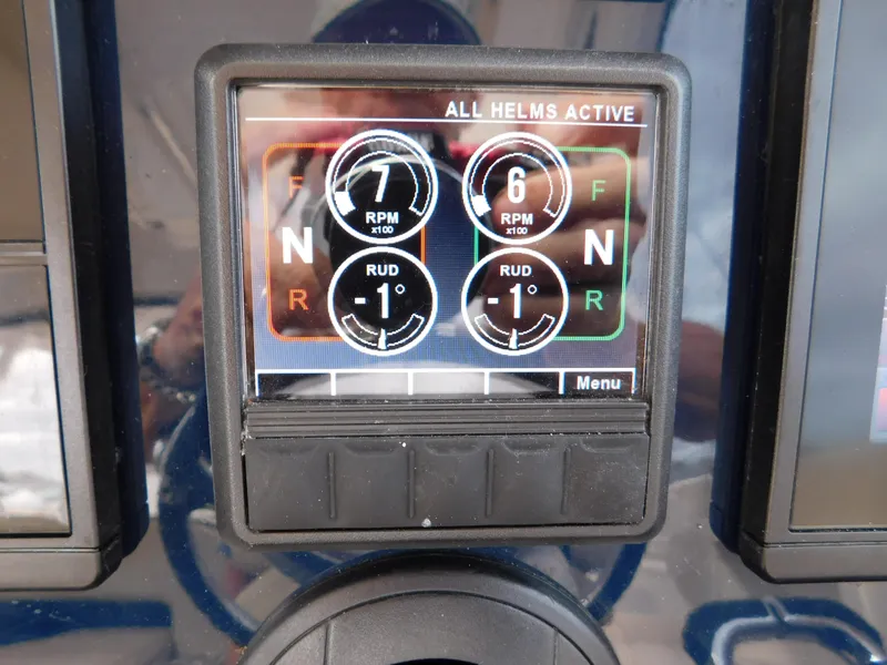 Slide: The Image of Display panel of 2018 Pursuit OS 325 Offshore showing RPM and rudder settings. - 15