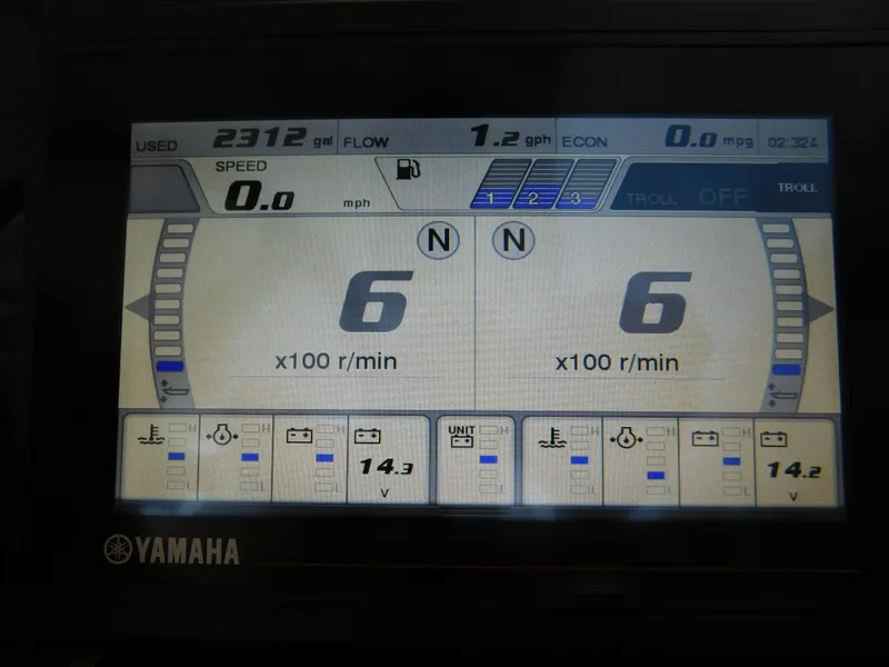 Slide: The Image of Yamaha display panel on 2018 Pursuit OS 325 Offshore boat showing engine metrics. - 17