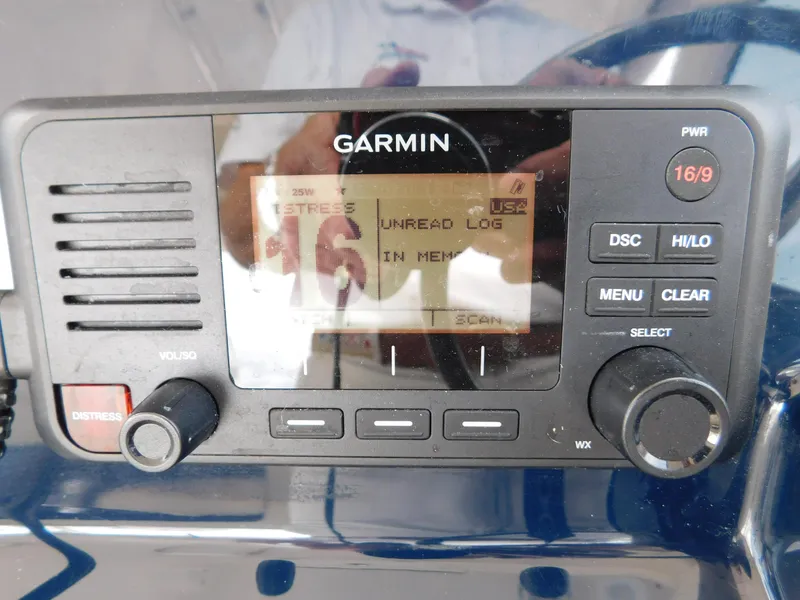 Slide: The Image of Garmin marine radio on 2018 Pursuit OS 325 Offshore boat dashboard. - 20
