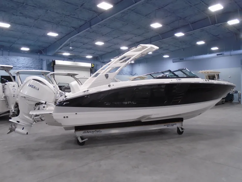 Slide: The Image of 2025 Regal LX6 boat in showroom, side view, sleek design, Yamaha engine. - 20