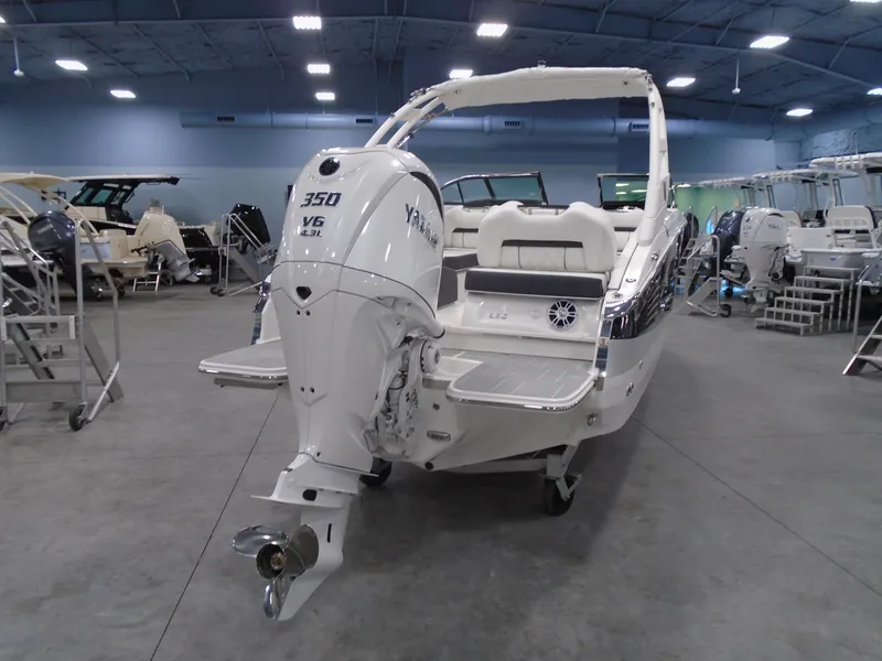 Slide: The Image of 2025 Regal LX6 boat with Yamaha 350 V6 engine in showroom. - 22