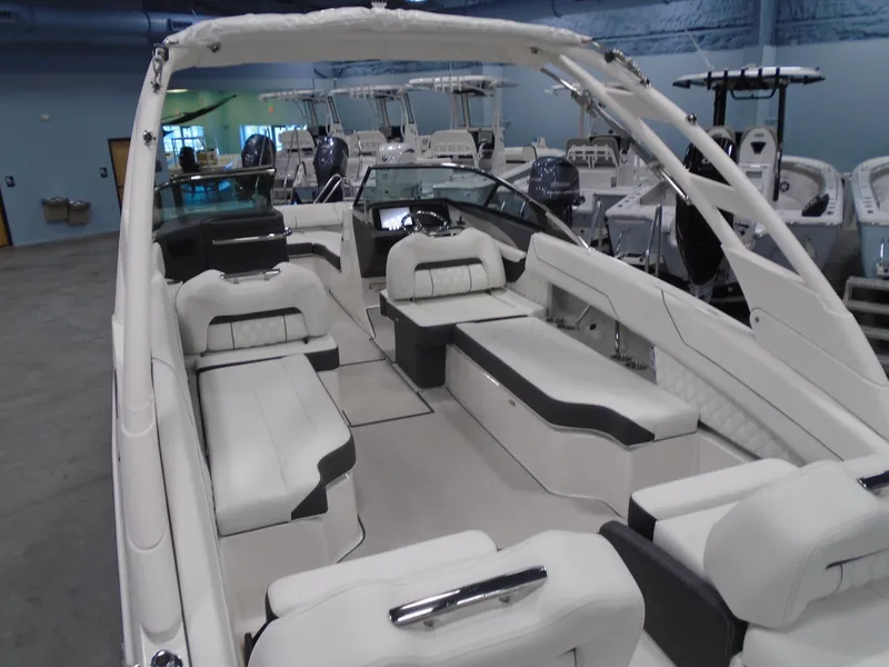 Slide: The Image of 2025 Regal LX6 boat interior with luxurious seating and modern design. - 25