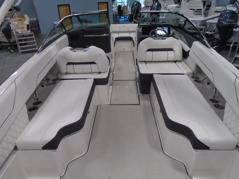 Slide: The Image of 2025 Regal LX6 boat interior with luxurious white seating and modern design. - 26
