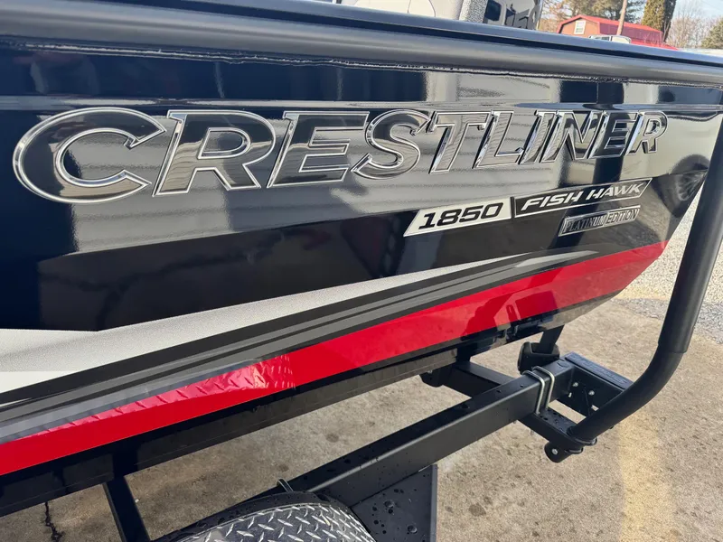 Slide: The Image of 2025 Crestliner 1850 Fish Hawk WT JS boat, black and red exterior detail. - 9