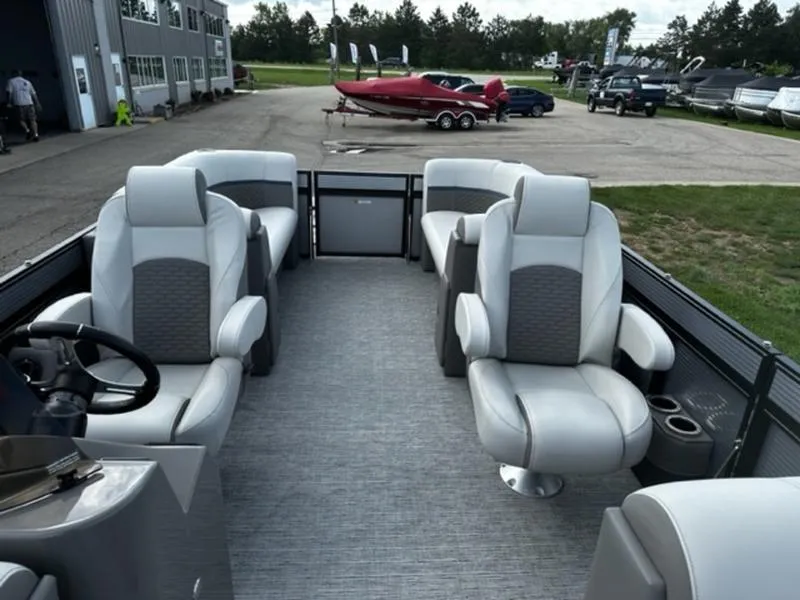 Slide: The Image of 2024 Qwest E824 RLS LTZ pontoon boat interior with luxurious seating and modern design. - 6