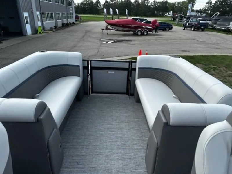 Slide: The Image of 2024 Qwest E824 RLS LTZ pontoon boat interior with spacious seating. - 7