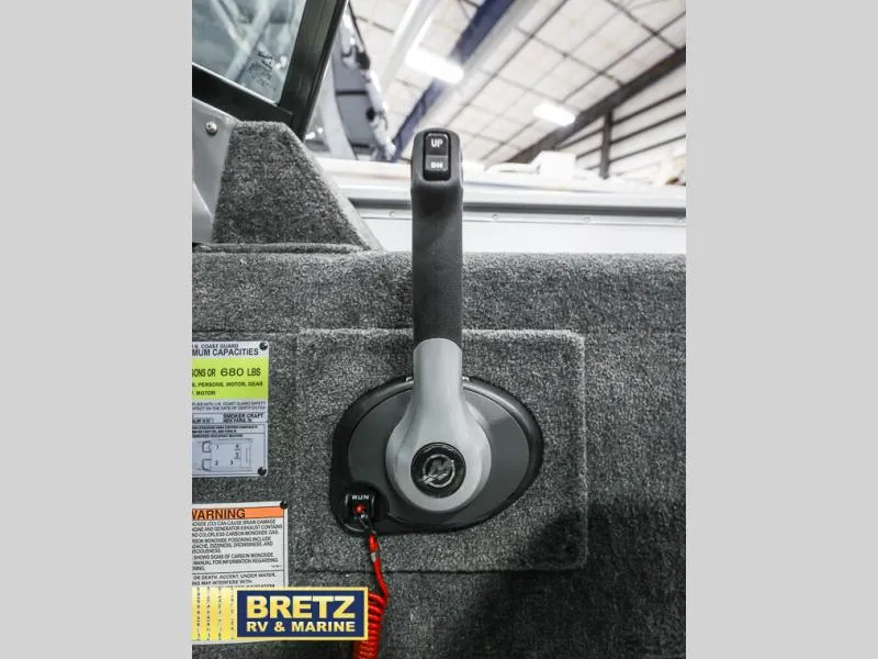 Slide: The Image of 2024 PRO ANGLER 162 boat throttle control with warning labels, displayed at Bretz RV & Marine. - 11
