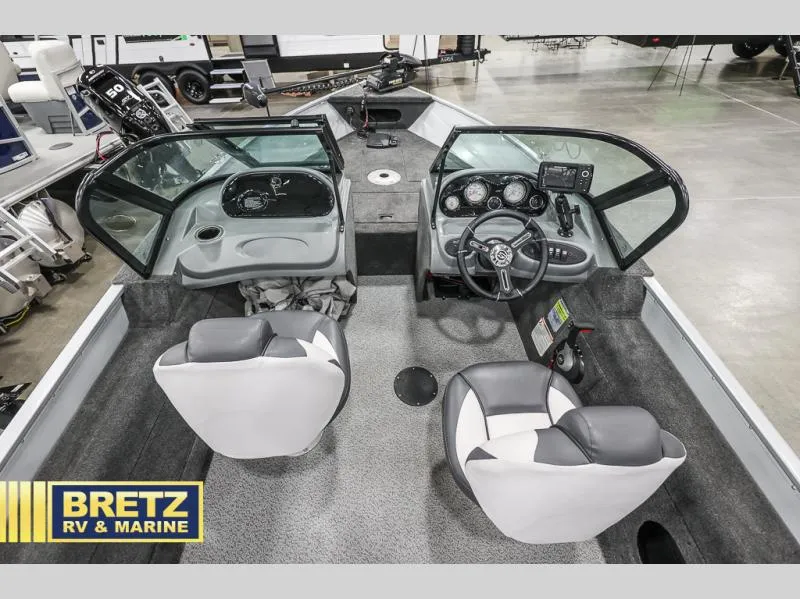 Slide: The Image of 2024 PRO ANGLER 162 boat interior with dual seats and control panel at Bretz RV & Marine. - 14