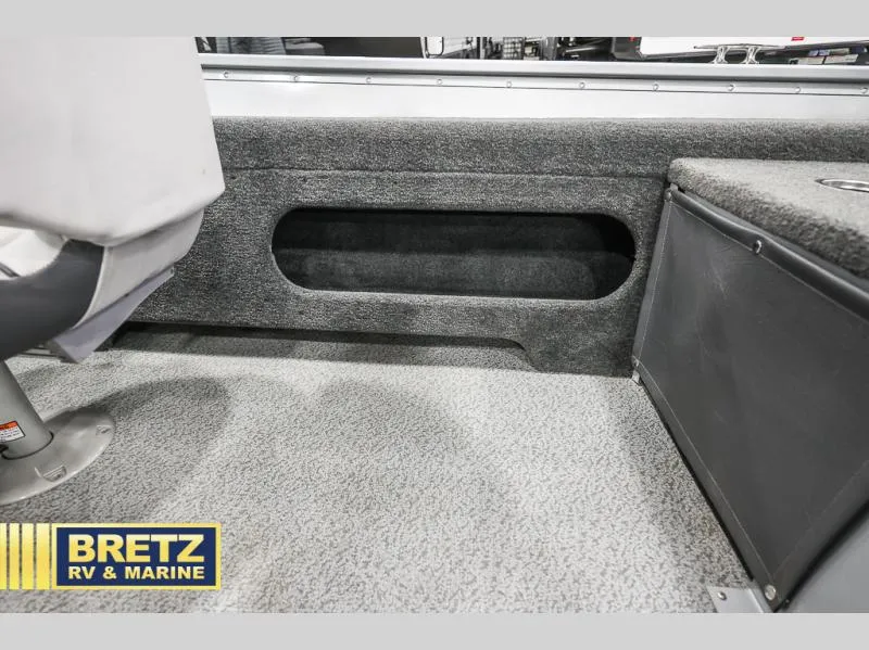 Slide: The Image of 2024 PRO ANGLER 162 boat interior with seating and storage, Bretz RV & Marine branding. - 26