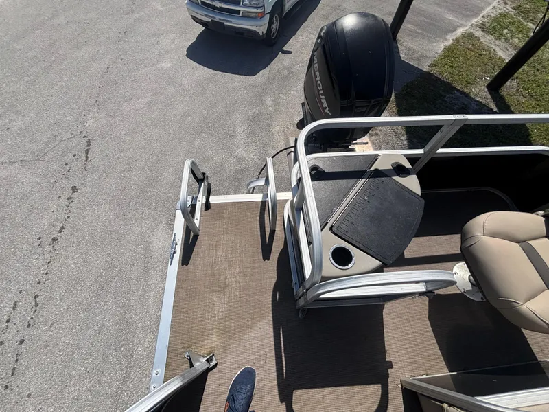 Slide: The Image of 2020 Sun Tracker Bass Buggy 18 DLX pontoon boat with Mercury outboard motor. - 11