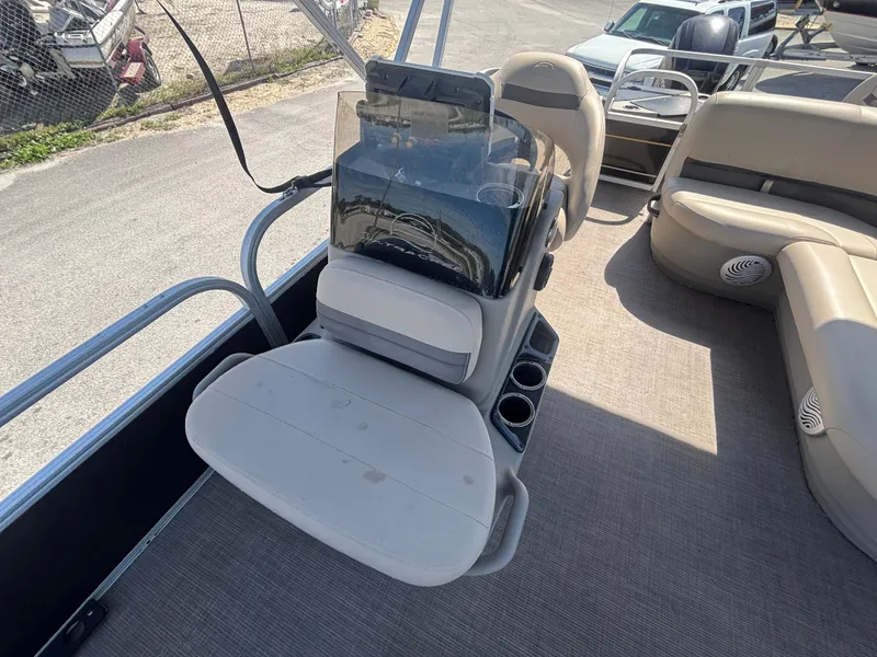 Slide: The Image of 2020 Sun Tracker Bass Buggy 18 DLX pontoon boat interior with seating and console. - 16