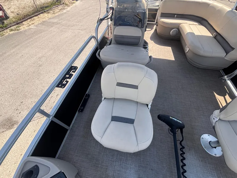 Slide: The Image of 2020 Sun Tracker Bass Buggy 18 DLX interior with seating and steering console. - 21