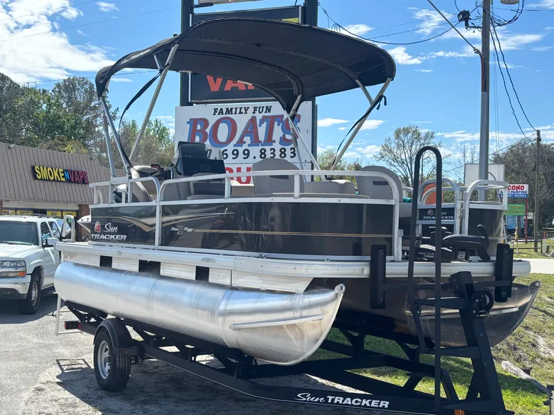 Slide: The Image of 2020 Sun Tracker Bass Buggy 18 DLX pontoon boat on trailer, outdoor display. - 3