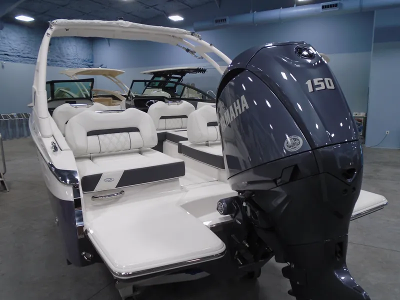 Slide: The Image of 2025 Regal LX2 boat with Yamaha 150 outboard motor in showroom. - 3