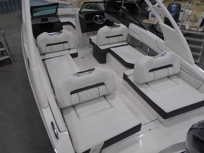 Slide: The Image of 2025 Regal LX2 boat interior with luxurious white seating and modern design. - 4