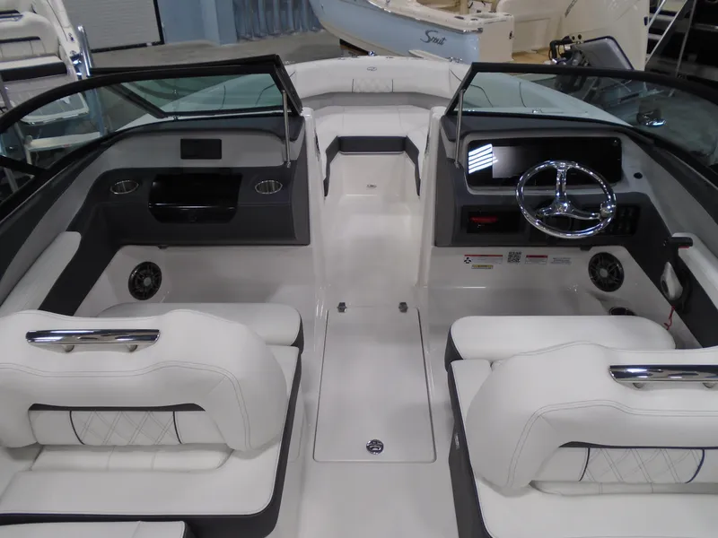 Slide: The Image of Interior of 2025 Regal LX2 boat with modern dashboard and seating. - 6