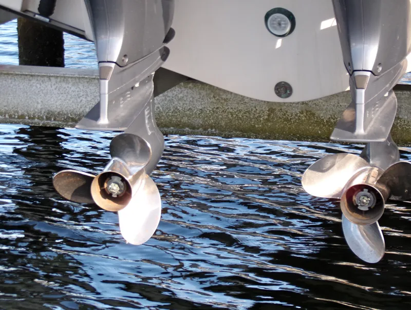 Slide: The Image of Twin propellers of a 2016 Grady-White Freedom 275 boat over water. - 18