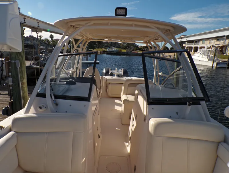 Slide: The Image of 2016 Grady-White Freedom 275 boat interior at a marina dock. - 21