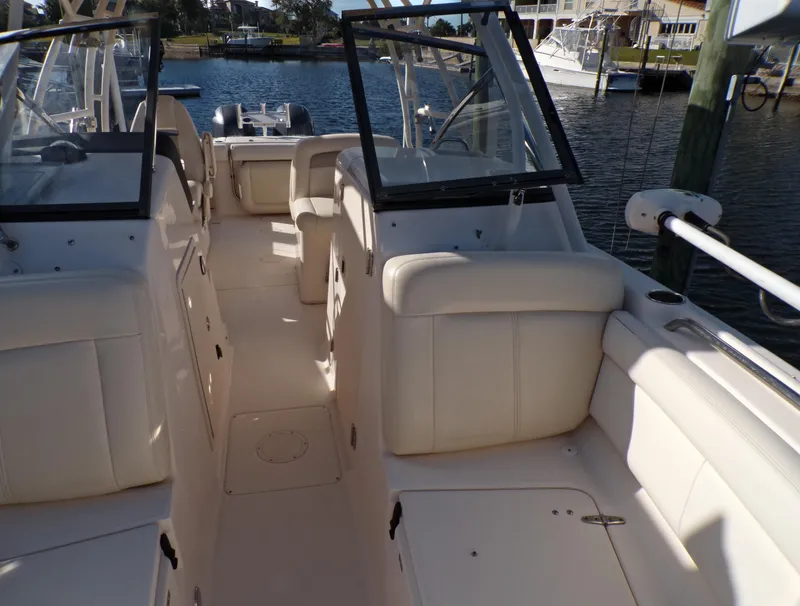 Slide: The Image of 2016 Grady-White Freedom 275 boat interior with white seating and open deck. - 22