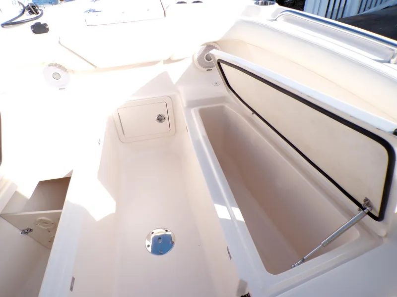 Slide: The Image of 2016 Grady-White Freedom 275 boat interior with open storage compartments. - 24