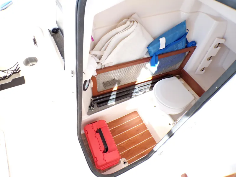 Slide: The Image of 2016 Grady-White Freedom 275 boat interior with storage, toilet, and accessories. - 36