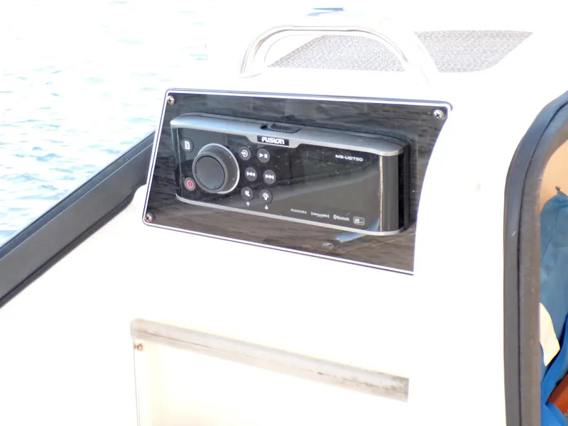 Slide: The Image of Fusion marine stereo on 2016 Grady-White Freedom 275 boat dashboard. - 37