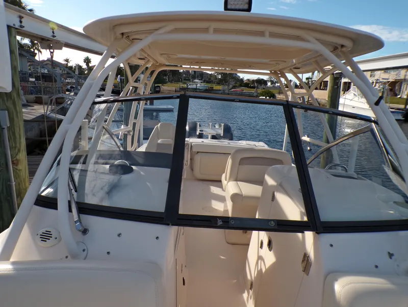 Slide: The Image of 2016 Grady-White Freedom 275 boat interior, docked by the water. - 40